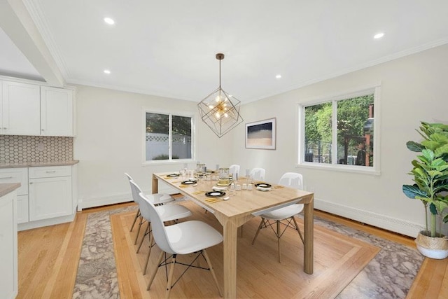 77 Greenwood Ln, White Plains, NY 10607 - dining room featuring crown molding, light wood-style floors, a chandelier, recessed lighting, and baseboards