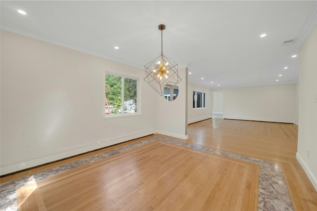 77 Greenwood Ln, White Plains, NY 10607 - empty room with a chandelier, light wood-style flooring, baseboards, ornamental molding, and a baseboard radiator
