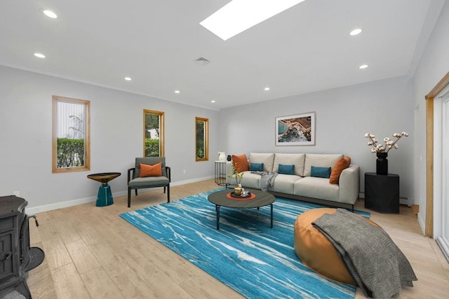 77 Greenwood Ln, White Plains, NY 10607 - living room featuring light wood-style floors, recessed lighting, baseboards, and a wood stove