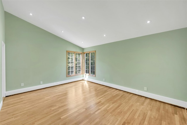 77 Greenwood Ln, White Plains, NY 10607 - empty room featuring vaulted ceiling, wood finished floors, baseboards, and recessed lighting