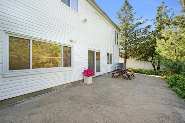 77 Greenwood Ln, White Plains, NY 10607 - rear view of house featuring a patio area and central AC unit