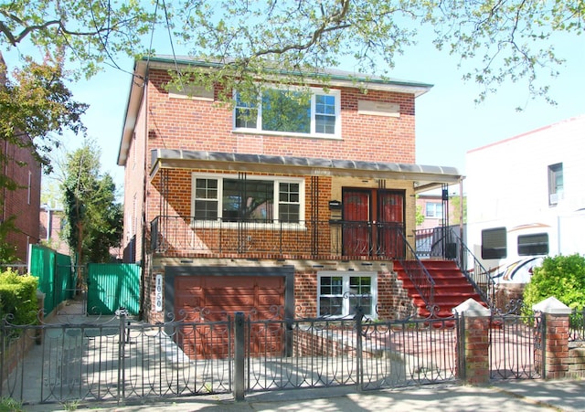 view of front facade with brick siding, stairs, concrete driveway, an attached garage, and a fenced front yard