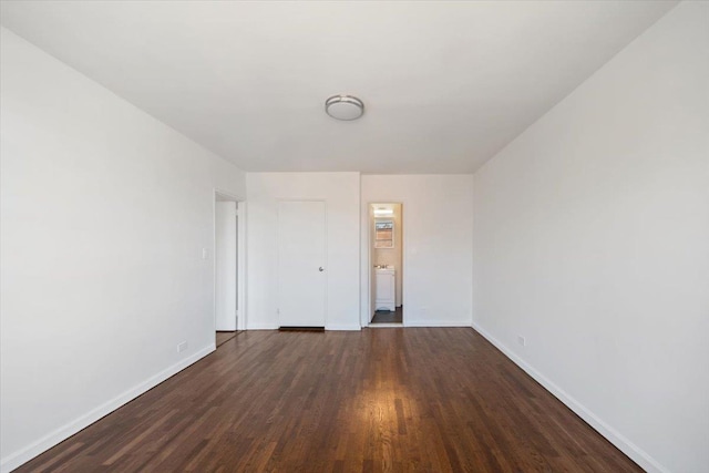spare room with wood finished floors and baseboards