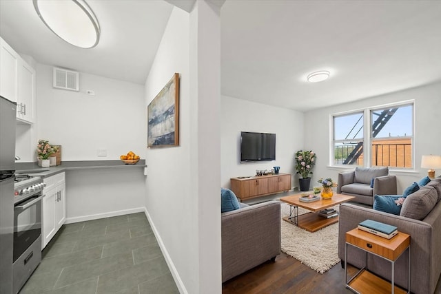 living area featuring baseboards
