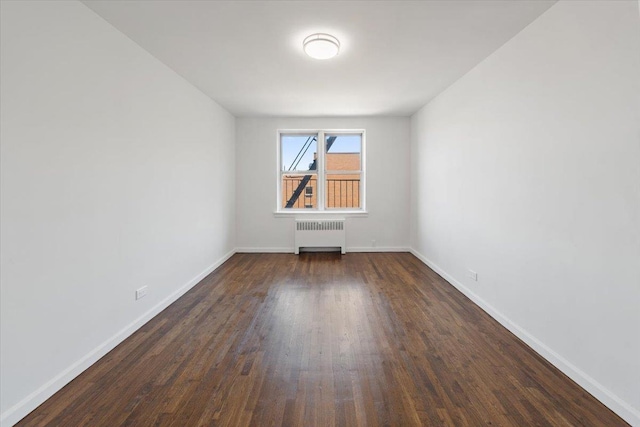 2630 Kingsbridge Ter Unit 5Hi, Bronx, NY 10463 - unfurnished room featuring radiator heating unit, dark wood-type flooring, and baseboards