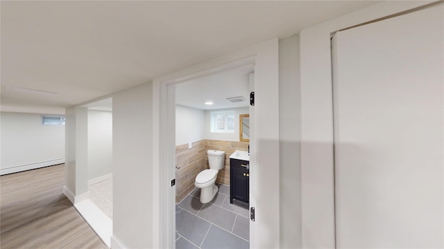 250 Cedar Hill Ave, Nyack, NY 10960 - bathroom with tile walls, toilet, a baseboard heating unit, visible vents, and vanity