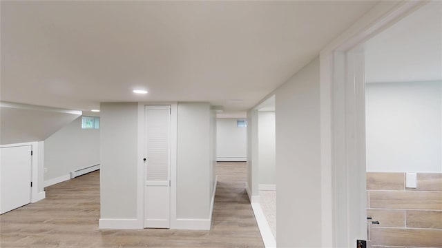 250 Cedar Hill Ave, Nyack, NY 10960 - finished below grade area featuring a baseboard radiator, baseboards, and light wood-type flooring