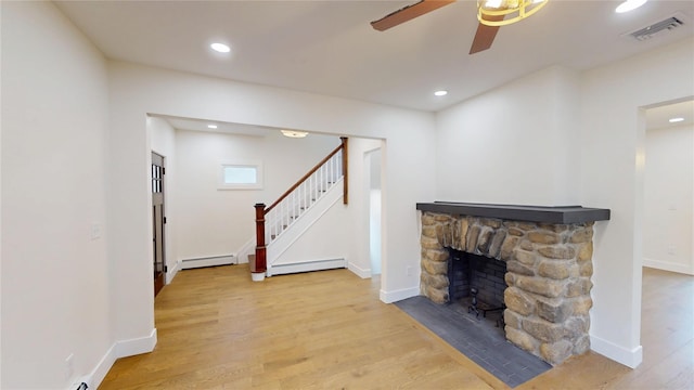 250 Cedar Hill Ave, Nyack, NY 10960 - unfurnished living room with ceiling fan, a baseboard radiator, visible vents, and wood finished floors