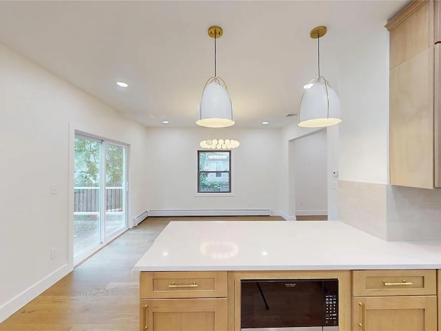 250 Cedar Hill Ave, Nyack, NY 10960 - kitchen featuring baseboard heating, light countertops, light wood finished floors, a peninsula, and recessed lighting