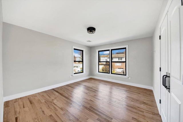 169 Bretton Rd, Yonkers, NY 10710 - unfurnished bedroom with baseboards and wood finished floors