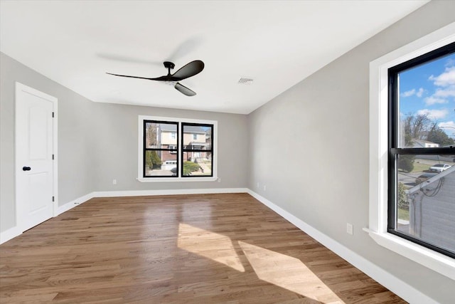 169 Bretton Rd, Yonkers, NY 10710 - spare room featuring baseboards, a ceiling fan, wood finished floors, and visible vents