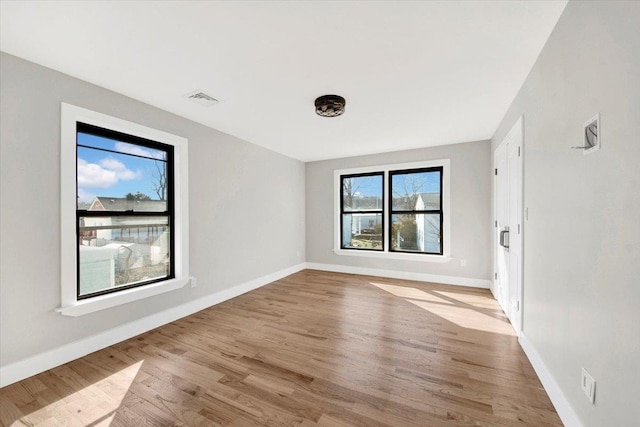169 Bretton Rd, Yonkers, NY 10710 - unfurnished room featuring baseboards, wood finished floors, and visible vents