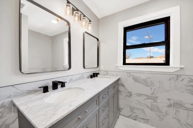 169 Bretton Rd, Yonkers, NY 10710 - bathroom with a sink, double vanity, and marble finish floor