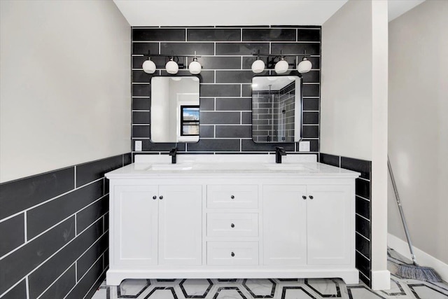 169 Bretton Rd, Yonkers, NY 10710 - bathroom with double vanity, a sink, and tile walls
