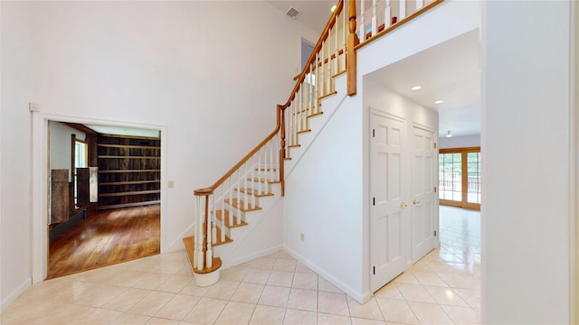 11 Hidden Meadow Rd, Warwick, NY 10990 - stairs featuring tile patterned flooring, recessed lighting, built in shelves, and a high ceiling