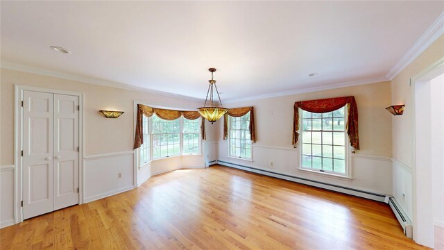 11 Hidden Meadow Rd, Warwick, NY 10990 - unfurnished dining area with light wood-type flooring, a baseboard heating unit, and ornamental molding