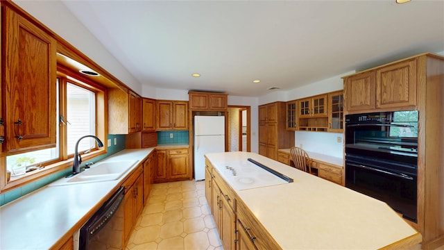 11 Hidden Meadow Rd, Warwick, NY 10990 - kitchen with black appliances, light countertops, brown cabinets, and recessed lighting