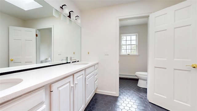 11 Hidden Meadow Rd, Warwick, NY 10990 - full bath featuring a baseboard radiator, double vanity, and tile patterned floors