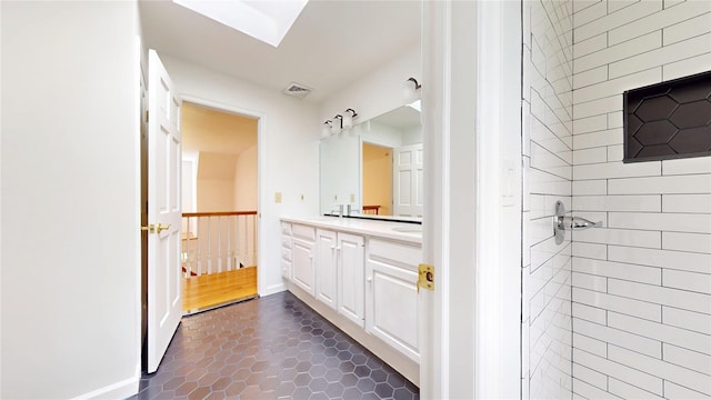 11 Hidden Meadow Rd, Warwick, NY 10990 - bathroom featuring vanity, tile patterned floors, a skylight, and a tile shower