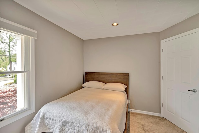 bedroom featuring recessed lighting, baseboards, and light carpet