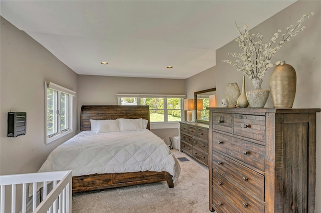 bedroom featuring heating unit, visible vents, recessed lighting, and light colored carpet