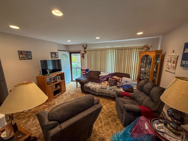 living area with carpet floors and recessed lighting