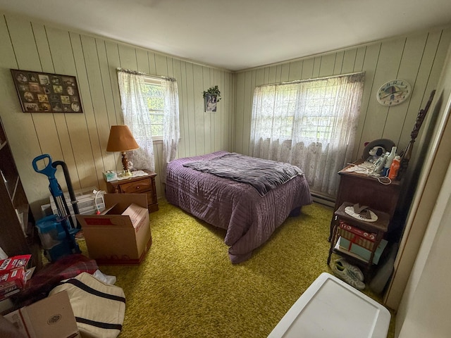 carpeted bedroom featuring a baseboard radiator