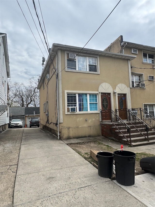 multi unit property with cooling unit and stucco siding