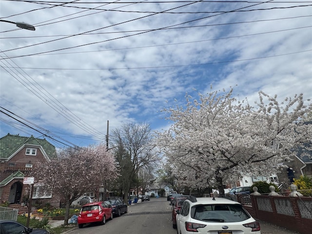 view of road featuring sidewalks and a residential view