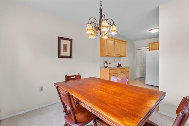 1 Lakeview Dr Unit 1L, Peekskill, NY 10566 - dining area with a chandelier, light carpet, and baseboards