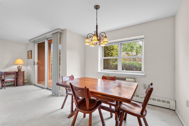 1 Lakeview Dr Unit 1L, Peekskill, NY 10566 - dining space featuring a baseboard radiator, a chandelier, and light carpet