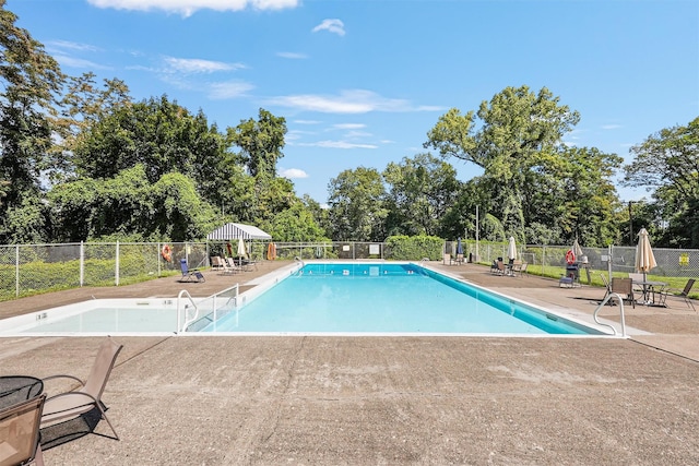 1 Lakeview Dr Unit 1L, Peekskill, NY 10566 - community pool with a patio, fence, and view of scattered trees