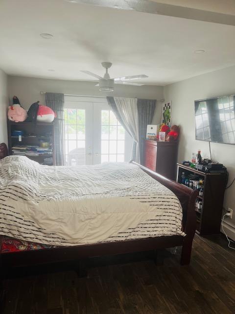 bedroom with wood finished floors and a ceiling fan