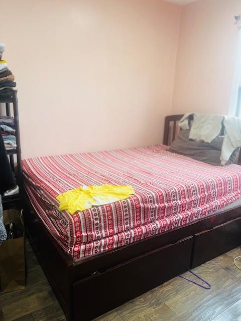 bedroom with wood finished floors