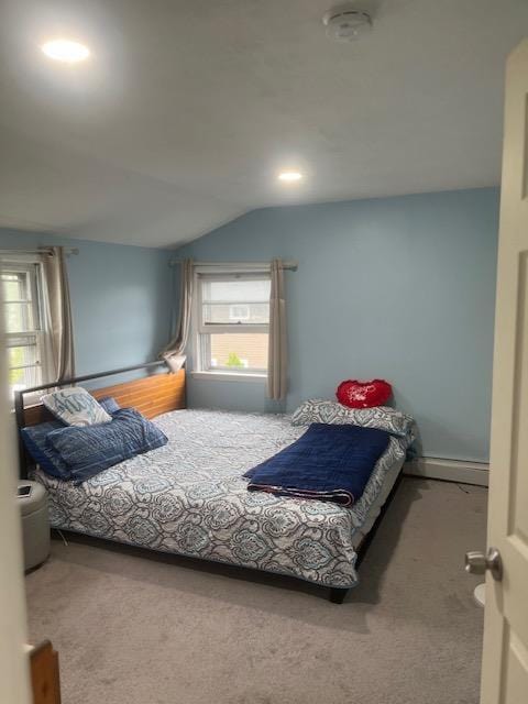 carpeted bedroom featuring vaulted ceiling
