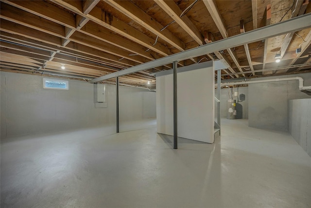 basement with water heater and electric panel