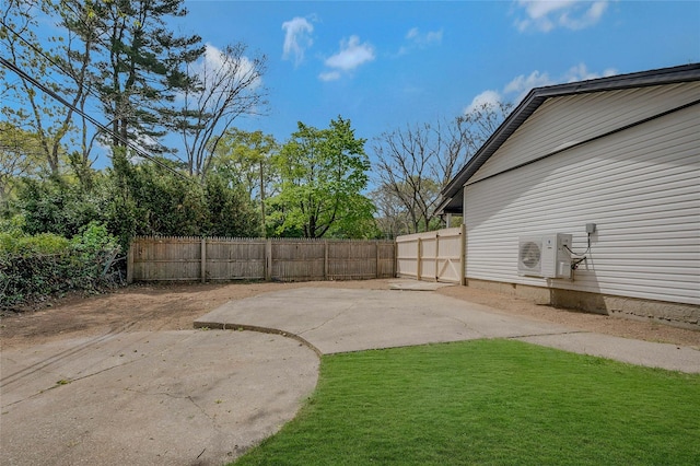 view of yard with a patio, ac unit, and fence