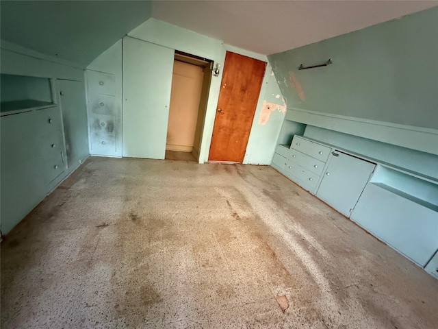 bonus room featuring vaulted ceiling