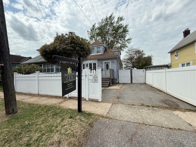 view of outdoor structure with a gate and fence private yard