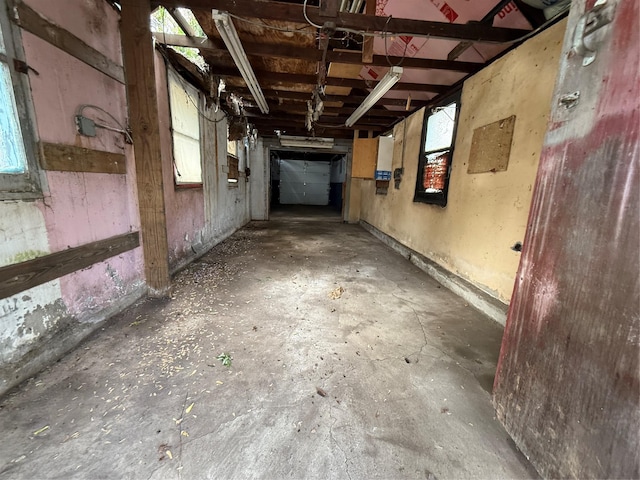 interior space with unfinished concrete flooring