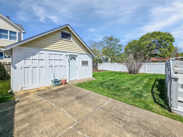 1994 Pine St, North Baldwin, NY 11510 - rear view of property featuring an outdoor structure and a patio area