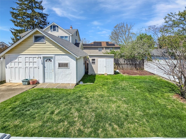 1994 Pine St, North Baldwin, NY 11510 - back of property with a shed, roof with shingles, and stucco siding