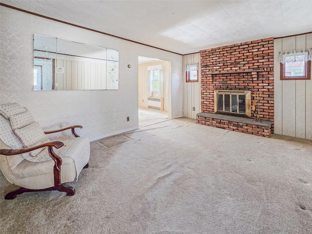 1994 Pine St, North Baldwin, NY 11510 - unfurnished living room featuring a brick fireplace and carpet flooring