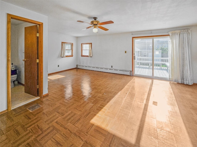 1994 Pine St, North Baldwin, NY 11510 - empty room featuring a baseboard heating unit and a ceiling fan