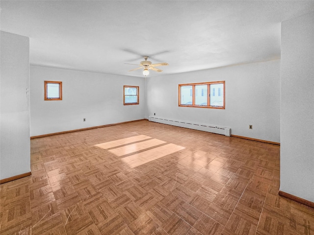 1994 Pine St, North Baldwin, NY 11510 - unfurnished room featuring a baseboard heating unit and ceiling fan