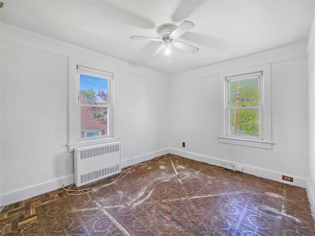 1994 Pine St, North Baldwin, NY 11510 - spare room featuring radiator and ceiling fan