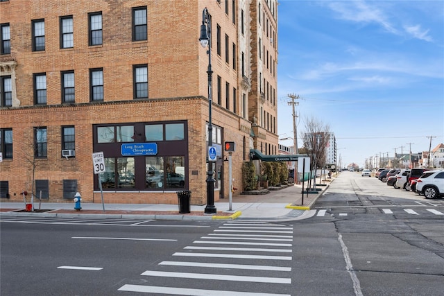 view of property featuring uncovered parking