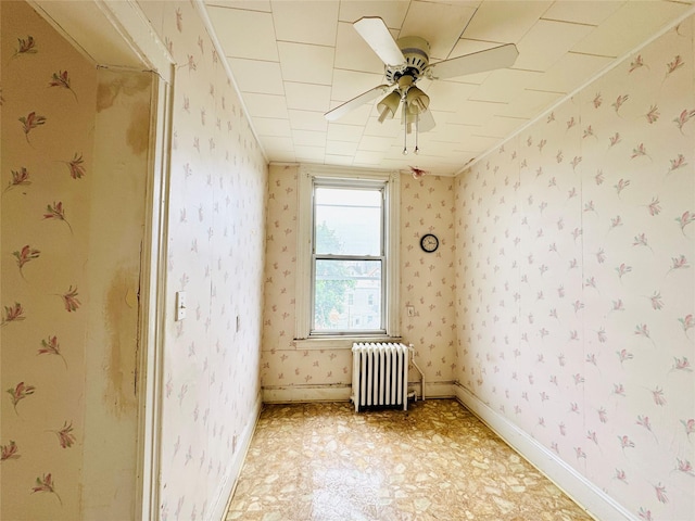 68-11 52nd Dr, Maspeth, NY 11378 - unfurnished room with radiator, wallpapered walls, a ceiling fan, and light floors