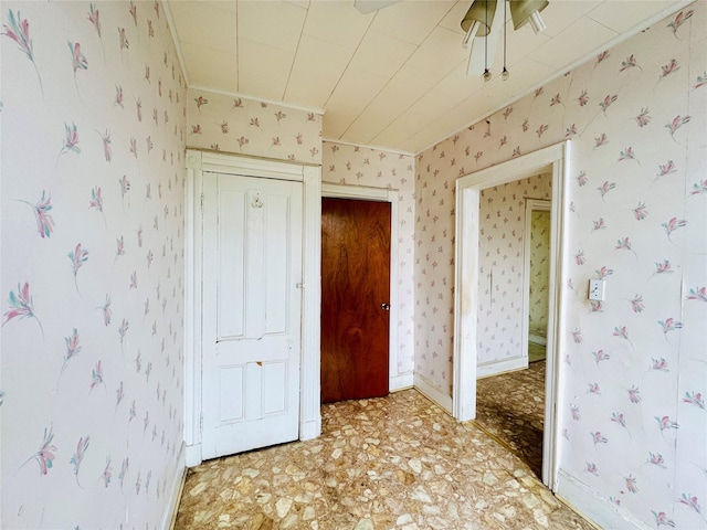 68-11 52nd Dr, Maspeth, NY 11378 - unfurnished bedroom featuring crown molding, light floors, wallpapered walls, and baseboards