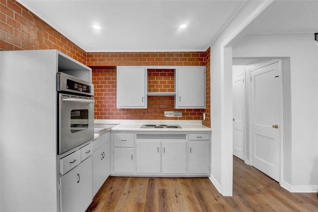 30 Inwood Rd, Glen Cove, NY 11542 - kitchen featuring white electric stovetop, light countertops, white cabinets, and oven